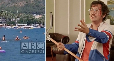 Marmaris'te Köpek Balığı Paniği: Vatandaşlar Paspasla Müdahale Etti